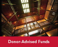A view of looking up at an atrium staircase. Links to Donor-Advised Funds