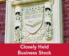 Engraved sigil on a building. Links to Closely Held Business Stock